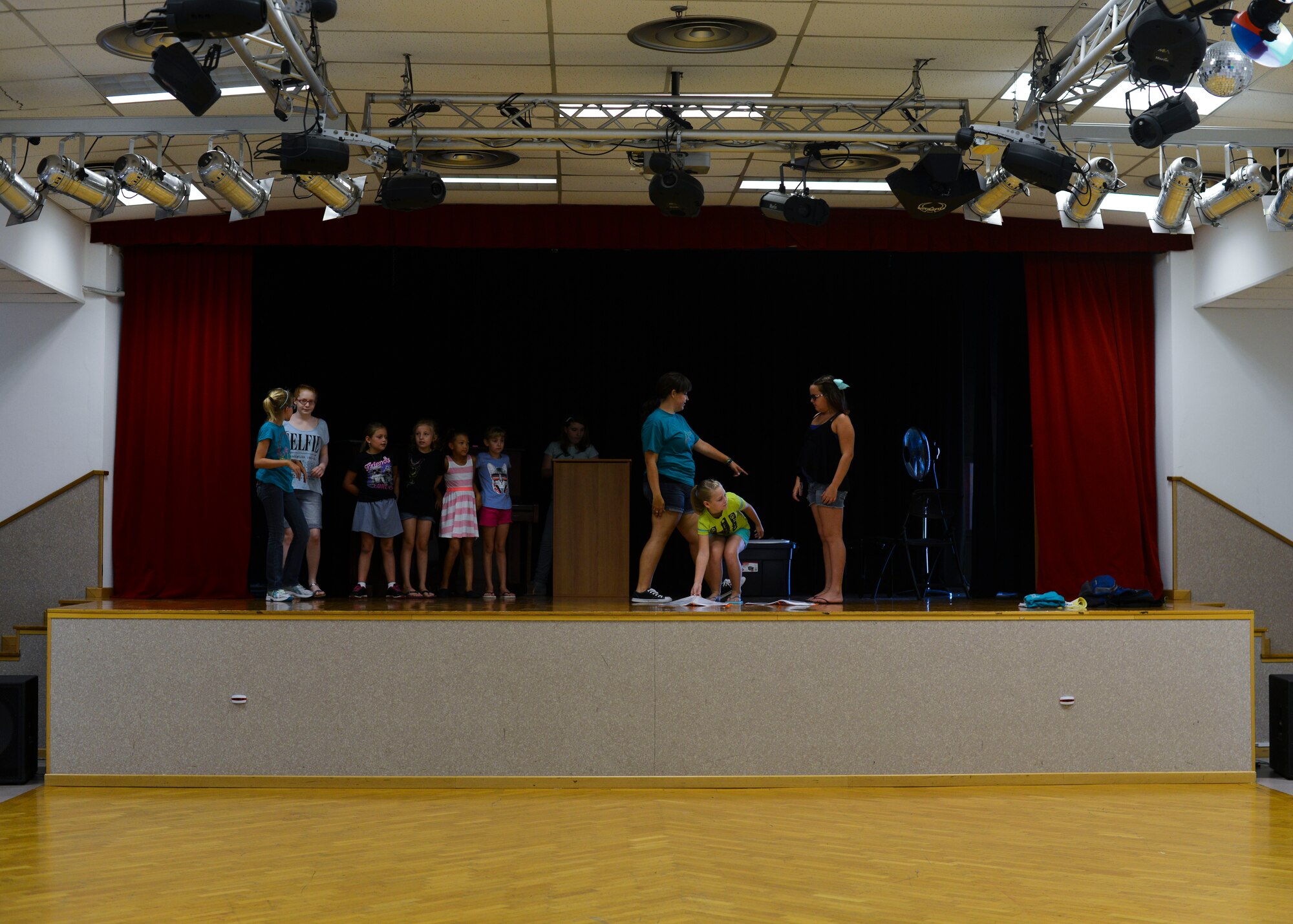 Members of the “Aladdin” cast rehearse, Aug. 4, 2015, at Aviano Air Base, Italy. Children of all ages had an opportunity to perform as actors, stage hands and assistant directors. (U.S. Air Force photo by Senior Airman Austin Harvill/Released)