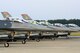 F-16CM Fighting Falcons assigned to the 20th Fighter Wing sit on the runway at Shaw Air Force Base, S.C., July 31, 2015. While participating in night flying training, the jets waited in line to be hot pit refueled, a rapid method of refueling that enables the aircraft to receive fuel while the engine is still running. (U.S. Air Force photo by Senior Airman Jensen Stidham/Released) 