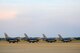 F-16CM Fighting Falcons assigned to the 20th Fighter Wing sit on the runway at Shaw Air Force Base, S.C., July 31, 2015. While participating in night flying training, the jets waited in line to be hot pit refueled, a rapid method of refueling that enables the aircraft to receive fuel while the engine is still running. (U.S. Air Force photo by Senior Airman Jensen Stidham/Released) 
