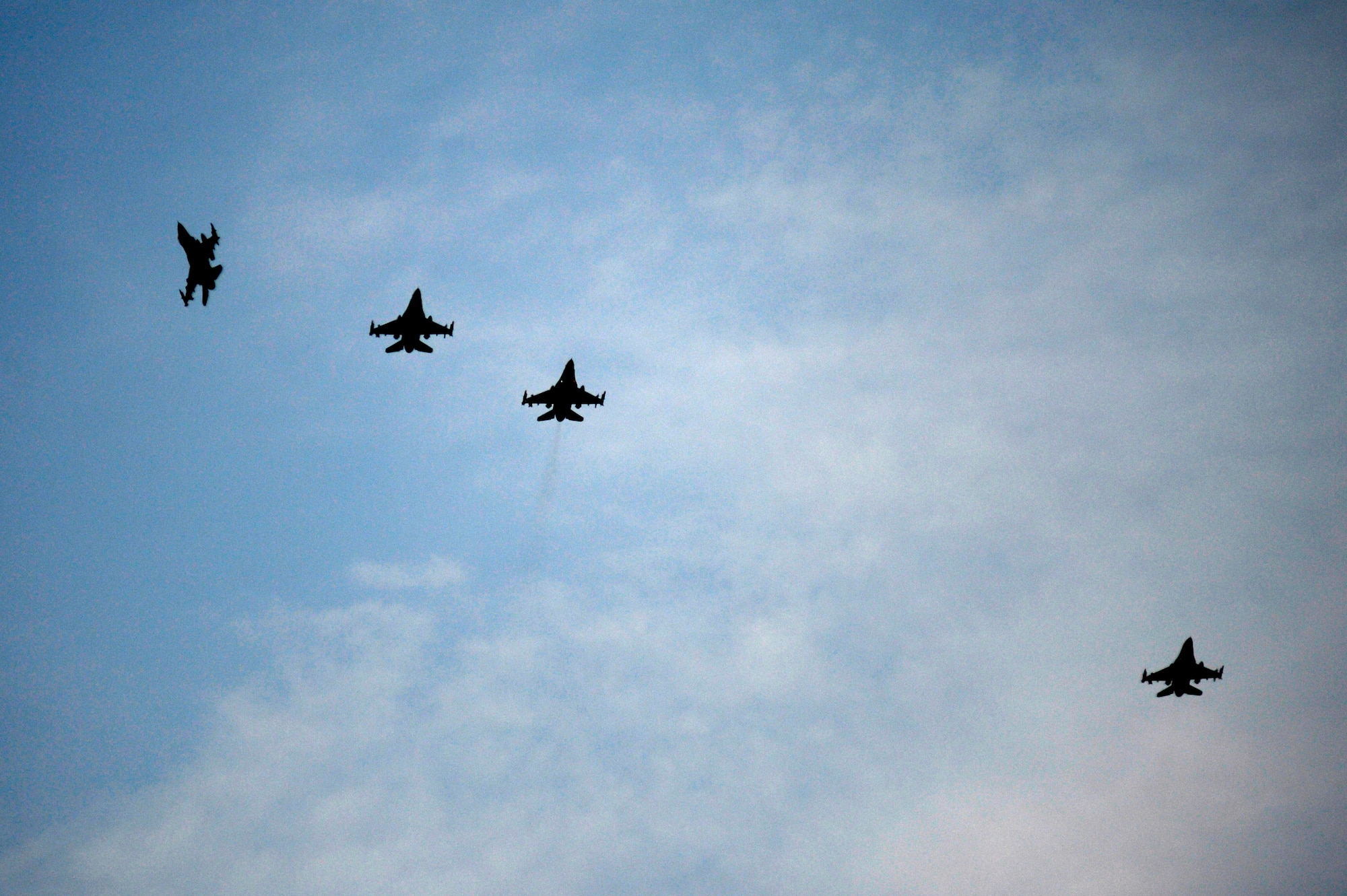 F-16CM Fighting Falcons perform a combat formation over Shaw Air Force Base, S.C., July 31, 2015. Pilots assigned to the 20th Fighter Wing conducted night flying training to be better prepared during low-light combat operations. (U.S. Air Force photo by Senior Airman Jensen Stidham/Released)