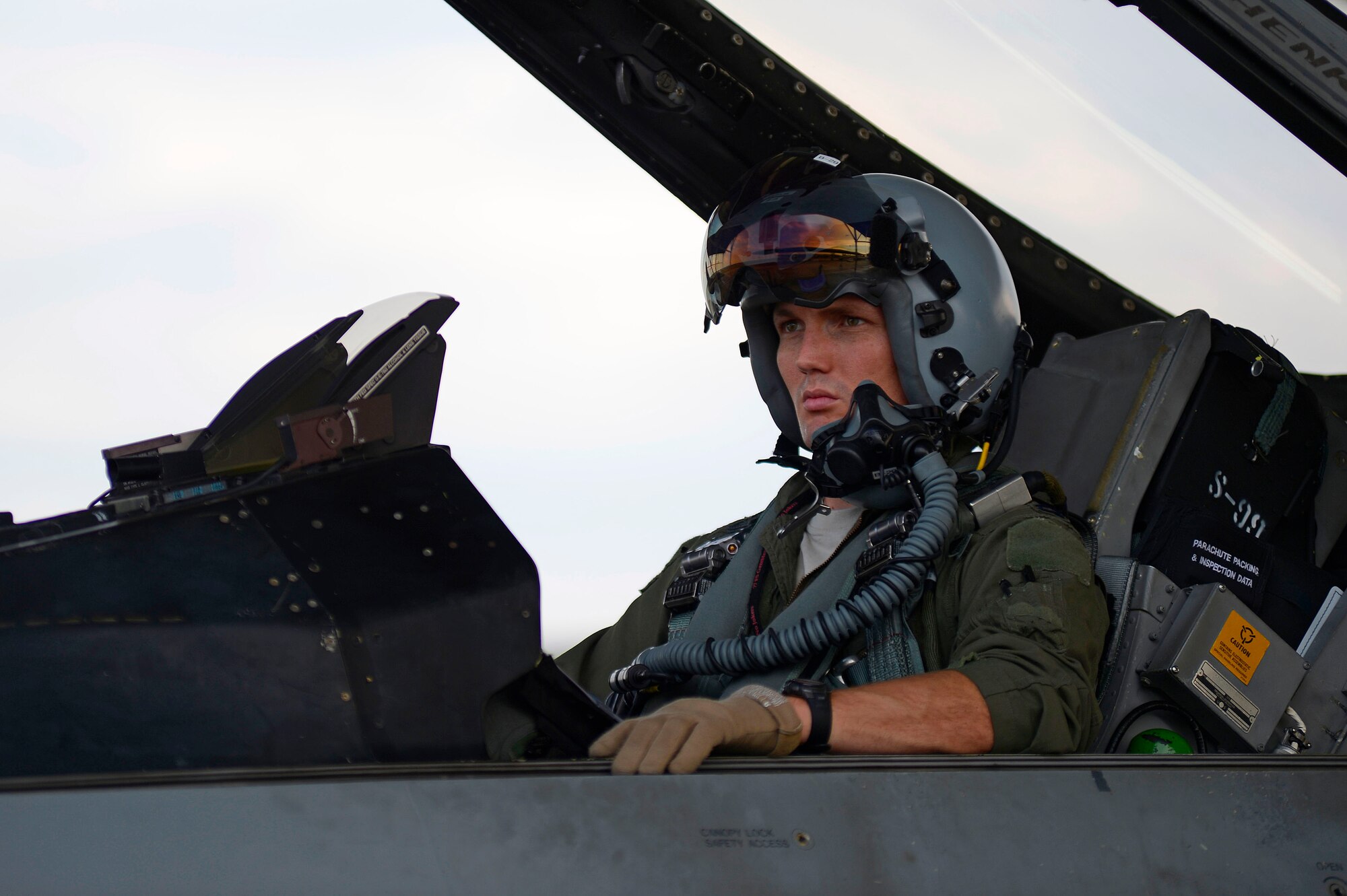U.S. Air Force Capt. David Hickle, 77th Fighter Squadron pilot, waits in the cockpit of an F-16CM Fighting Falcon at Shaw Air Force Base, S.C., Aug. 5, 2015. Hickle was preparing to participate in night flying operations, a series of training sorties, to practice nighttime combat tactics. (U.S. Air Force photo by Senior Airman Jensen Stidham/Released) 
