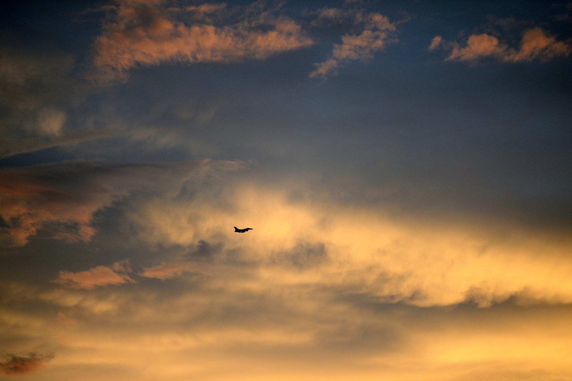 An F-16CM Fighting Falcon, assigned to the 20th Fighter Wing flies through the sky over Shaw Air Force Base, S.C., July 31, 2015. The 20th FW conducted night flying operations to provide Airmen the opportunity to train for deployment contingencies and operations occurring at night. (U.S. Air Force photo by Senior Airman Jensen Stidham/Released)