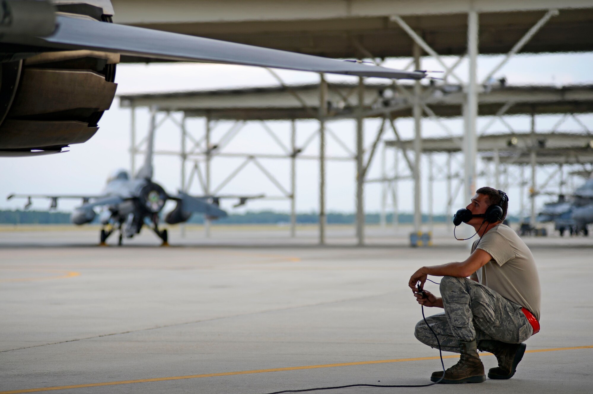 U.S. Air Force Senior Airman Brian Delancey, 20th Aircraft Maintenance Squadron, 55th Aircraft Maintenance Unit crew chief, conducts a pre-flight inspection for an F-16CM Fighting Falcon at Shaw Air Force Base, S.C., July 31, 2015. The 20th Fighter Wing conducted night flying to practice low-visibility flying training with night vision equipment. (U.S. Air Force photo by Senior Airman Jensen Stidham/Released)   