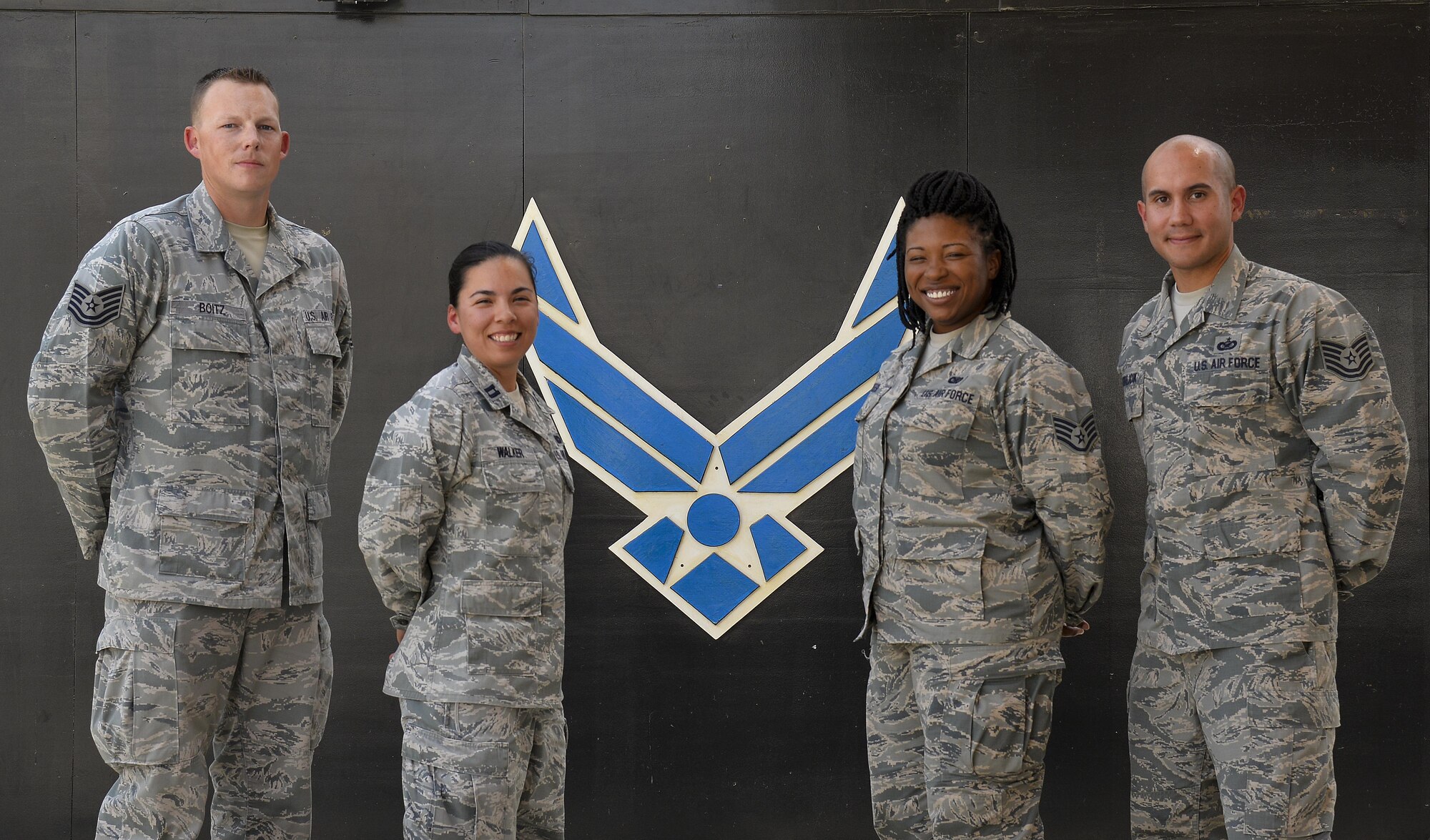 Members of the 380th Air Expeditionary Wing Public Affairs pose for a group photo at an undisclosed location in Southwest Asia, Aug. 6, 2015. The primary mission of PA is to inform the general public of the Air Force’s story.(Courtesy photo)