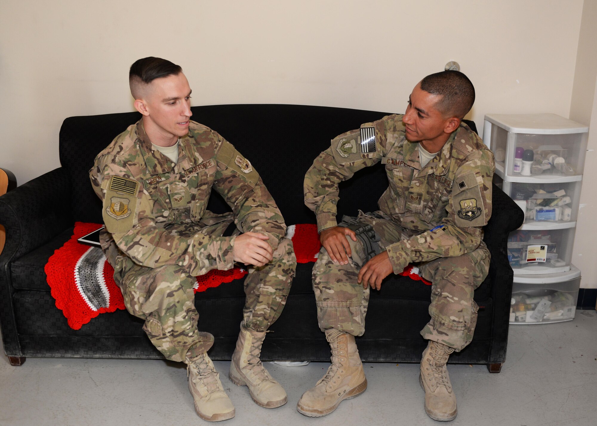 U.S. Air Force Staff Sgt. Anthony Camper, right, 455th Air Expeditionary Wing chaplain assistant, talks to Senior Airman Cory Gibson, 455th Air Expeditionary Wing finance office customer service technician, Aug. 6, 2015, at Bagram Airfield, Afghanistan. As a chaplain assistant, Camper acts as a mentor and provides counseling to BAF Airmen as well as Airmen in surrounding FOBs throughout the AOR, ensuring units maintain morale and remain spiritually and mentally fit to complete the mission. (U.S. Air Force photo by Senior Airman Cierra Presentado/Released)
