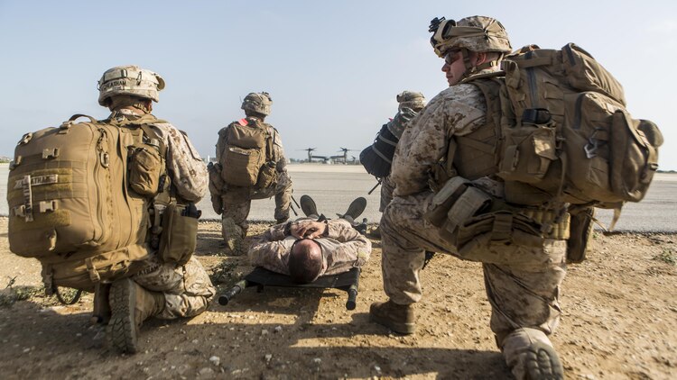 Marines with Special-Purpose Marine Air-Ground Task Force Crisis Response-Africa extract a simulated downed pilot during a tactical recovery of aircraft and personnel exercise aboard Naval Station Rota, Spain, August 3. The training allowed Marines to test their ability to rapidly launch and recover a simulated downed pilot.