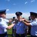 Freshly minted Cadet Fourth Class Matthew Carter, center, receives his shoulder boards during a ceremony, Aug. 4, 2015, at the U.S. Air Force Academy, Colorado Springs, Colorado. Carter now attends USAFA two years after finishing the on-site Teen Aviation Camp for youth exploring the academy as an option for college and a path to a military commission. 