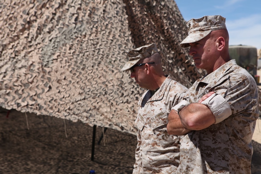 Brigadier Gen. David Ottignon, the commanding general of 1st Marine Logistics Group, observes Marines as they plan and discuss upcoming events for Integrated Training Exercise at Forward Operating Base 3 aboard Marine Corps Ground Air Combat Center Twentynine Palms, Calif., Aug. 5, 2015. Ottignon spoke with his Marines about morale, training and readiness.
