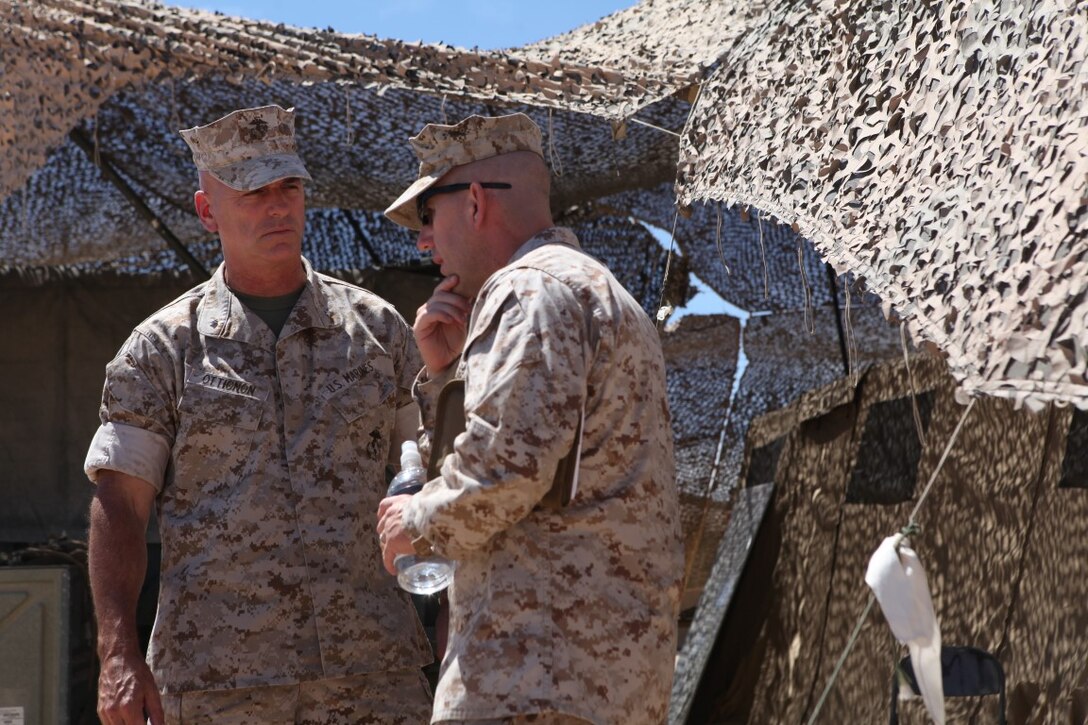Brigadier Gen. David Ottignon, the commanding general of 1st Marine Logistics Group, engages with Maj. David Saunders, the executive officer of Combat Logistics Battalion 1, 1st MLG, while visiting his Marines during Integrated Training Exercise at Forward Operating Base 3 aboard Marine Corps Ground Air Combat Center Twentynine Palms, Calif., Aug. 5, 2015. Ottignon toured the FOB and spoke with his Marines about morale, training and readiness.