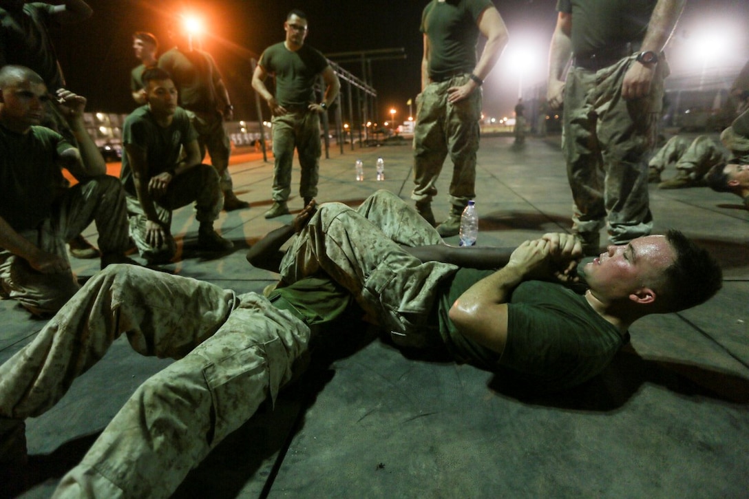CAMP LEMONNIER, Djibouti (Aug. 2, 2015) U.S. Marine Cpl. Joshua Haskell, right, instructs Marines in unarmed-combat techniques during a Marine Corps Martial Arts Program course.  Haskell is a machine-gun team leader with India Company, Battalion Landing Team 3rd Battalion, 1st Marine Regiment, 15th Marine Expeditionary Unit.  Elements of the 15th MEU are ashore in Djibouti for sustainment training to maintain and enhance the skills they developed during their pre-deployment training period.  The 15th MEU is currently deployed in support of maritime security operations and theater security cooperation efforts in the U.S. 5th Fleet area of operations. (U.S. Marine Corps photo by Sgt. Jamean Berry/Released)
