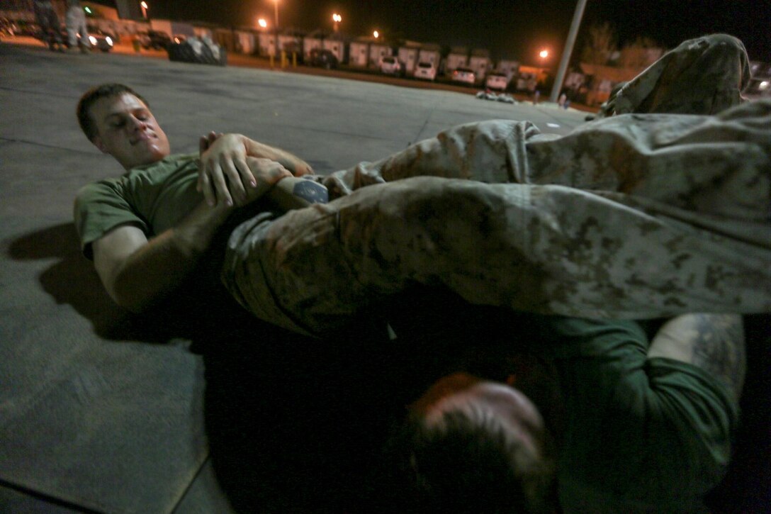CAMP LEMONNIER, Djibouti (Aug. 2, 2015) U.S. Marine Cpl. Drake Pierce practices unarmed-combat techniques during a Marine Corps Martial Arts Program course.  Pierce is a team leader with India Company, Battalion Landing Team 3rd Battalion, 1st Marine Regiment, 15th Marine Expeditionary Unit.  Elements of the 15th MEU are ashore in Djibouti for sustainment training to maintain and enhance the skills they developed during their pre-deployment training period.  The 15th MEU is currently deployed in support of maritime security operations and theater security cooperation efforts in the U.S. 5th Fleet area of operations. (U.S. Marine Corps photo by Sgt. Jamean Berry/Released)