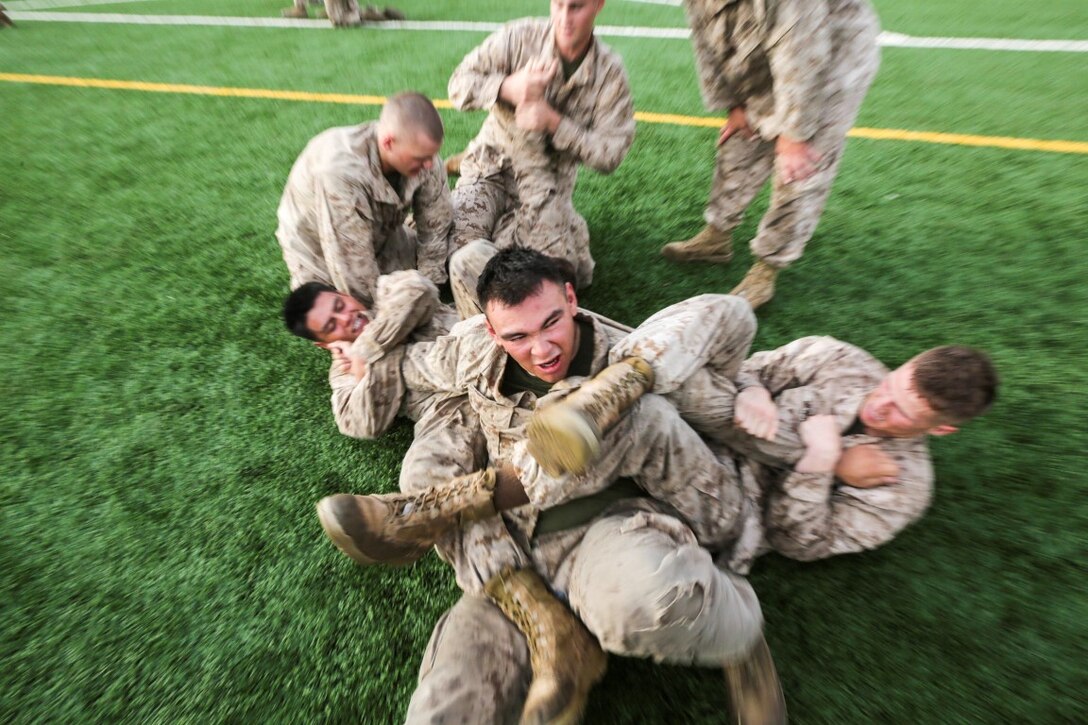 CAMP LEMONNIER, Djibouti (Aug. 5, 2015)  U.S. Marines with India Company, Battalion Landing Team 3rd Battalion, 1st Marine Regiment, 15th Marine Expeditionary Unit, practice unarmed combat techniques.  The Marines combine the physical training and teaching techniques to build small-unit leadership among their young Marines.  Elements of the 15th MEU are ashore in Djibouti for sustainment training to maintain and enhance the skills they developed during their pre-deployment training period.  The 15th MEU is currently deployed in support of maritime security operations and theater security cooperation efforts in the U.S. 5th Fleet area of operations. (U.S. Marine Corps photo by Sgt. Jamean Berry/Released)