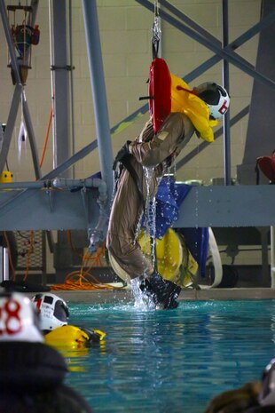 Cpl. Erban Maxwell simulates resque protocol during water survival training at Marine Corps Air Station Cherry Point, North Carolina, July 28, 2015. The Aviation Survival Training Center is the only water survival facility on any Marine Corps installation on the East Coast. Naval aviators are given classes on protocol and the gear they use in case of an emergency on an aircraft. The skills they learn in ASTC ensure 2nd Marine Aircraft Wing, its aviators and crew members are qualified and maintain the highest state of readiness. Maxwell is a maintenance administration sp