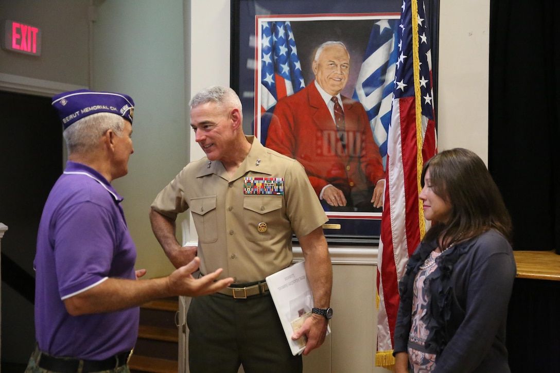 Maj. Gen. Brian Beaudreault, center, Commanding General, 2nd Marine Division, speaks with a veteran at a USO event hosted by retired  Sgt. Maj. Joe Houle with veterans of 4th Marine Division Association in Jacksonville, N.C., Aug. 4, 2015. Maj. Gen. Beaudreault spoke to the veterans about the Marine Corps in its present state. “What a great opportunity and privilege it is to speak to this group of veterans,” Beaudreault said. “These are the iconic veterans of the Marine Corps; Marines who landed on Saipan and Iwo Jima.” (U.S. Marine Corps photo by Lance Cpl. Chris Garcia/Released)