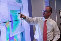 Dr. Mikel Petty, an instructor with the University of Alabama in Huntsville, shows measurements made during a modeling and simulation test during a certification course held in July at Marine Corps Base Quantico, Virginia. 