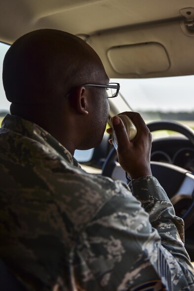 Tech. Sgt. Dominique Bonapart, 1st Special Operations Support Squadron airfield management operations NCO in-charge, requests approval to move onto the active runway during an airfield check on Hurlburt Field, Fla., Aug. 4, 2015. Airfield checks are performed every two hours to remove any foreign object debris that might end up on the airfield as aircraft take off and land. (U.S. Air Force photo/Senior Airman Jeff Parkinson)
