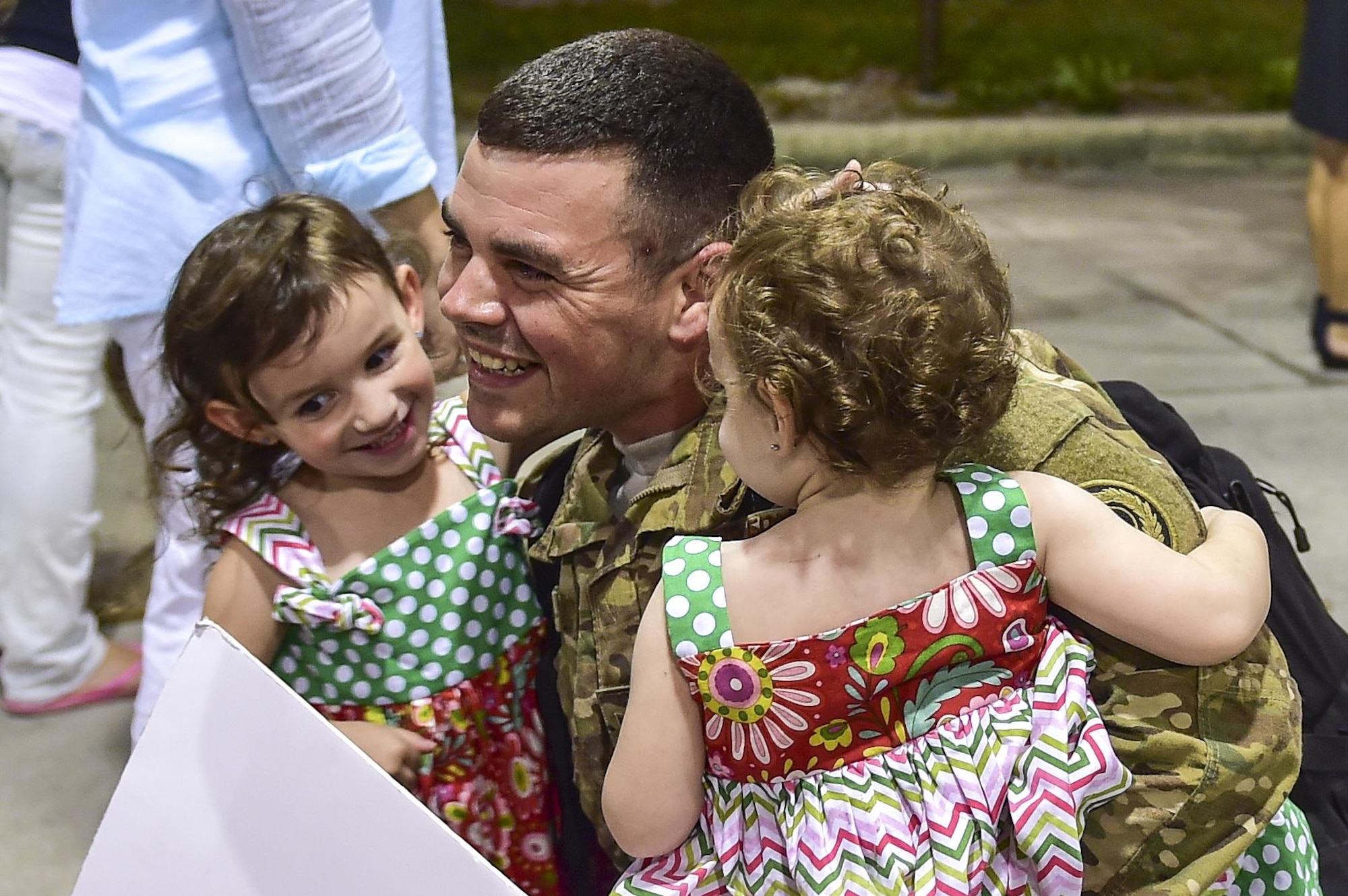 Staff Sgt. Timothy Wagster, 1st Special Operations Component Maintenance Squadron, is welcomed home by his family during Operation Homecoming on Hurlburt Field, Fla., Aug. 7, 2015. Operation Homecoming is a program created to welcome home Airmen returning from a recent deployment. (U.S. Air Force photo/Senior Airman Jeff Parkinson)