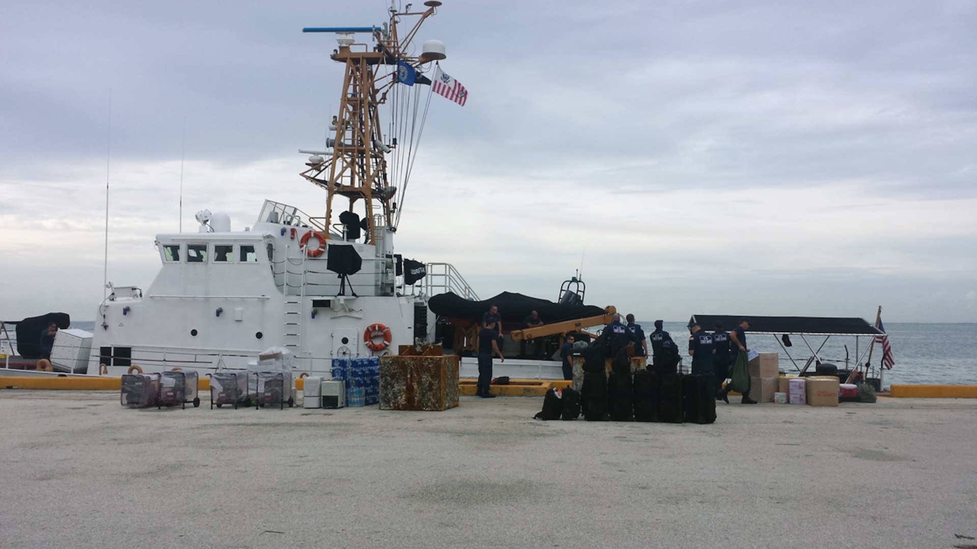 In this file, Coast Guard crews from the cutter Assateague and the Strike Team offload supplies from the cutter in Tanapag Harbor, Saipan, Aug. 5, 2015. The Assateague has an area of responsibility equivalent to the size of the continental United States. 