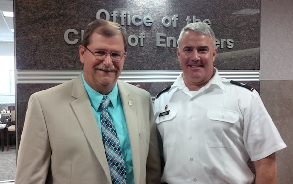 Mark Ringenberg, Louisville District program manager, stands with Brig. Gen. Richard Kaiser after receiving the USACE program manager of the year award