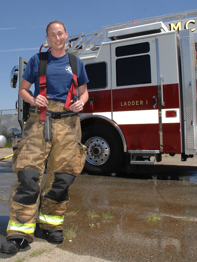 Megan Cornell, firefighter/nationally registered emergency medical technician – basic, Fire and Emergency Services, Marine Corps Logistics Base Albany, poses near one of MCLB Albany’s fire truckS after engaging in a controlled vehicle fire, recently.  Cornell is the recipient of MCLB Albany’s Firefighter of the Year Award for 2015; Public Safety Division Civilian Employee of the Year for 2015 and the Marine Corps Firefighter of the Year Award for 2015.