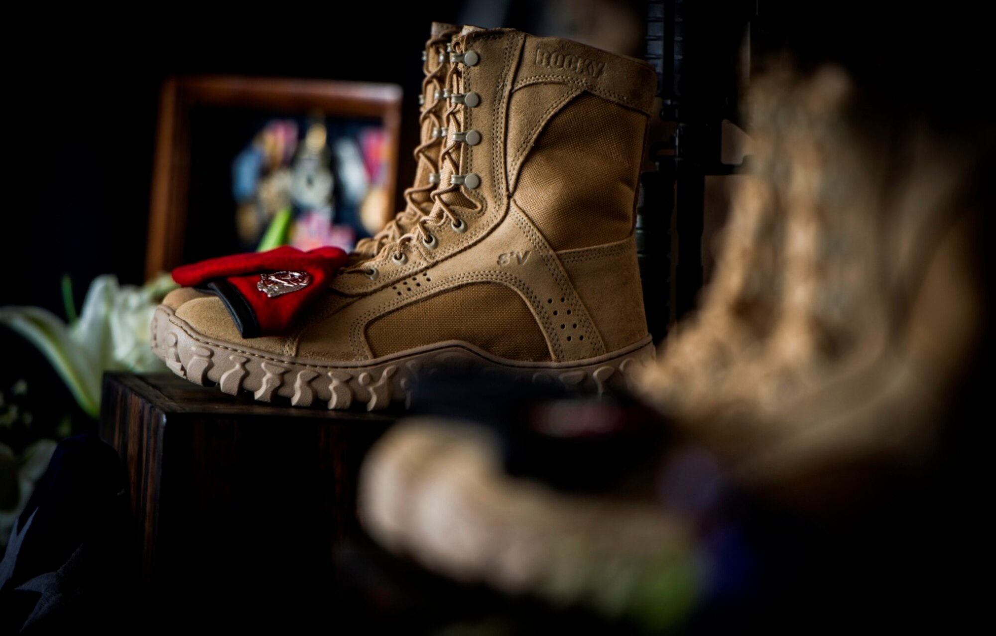 A traditional boots, helmet and weapon display stood as silent witnesses as more than 500 Airmen, friends and family members honored Tech. Sgt. Timothy Officer Jr., a tactical
air control party Airman, and Tech. Sgt. Marty Bettelyoun, a combat controller, at Hurlburt Field, Fla., Aug. 7, 2015. These men died from injuries sustained Aug. 3 in a freefall training accident on Eglin Range, Fla.  Both were assigned to the 24th Special Operations Wing, and they will be buried with full military honors. (U.S. Air Force photo by Senior Airman Christopher Callaway/Released)
