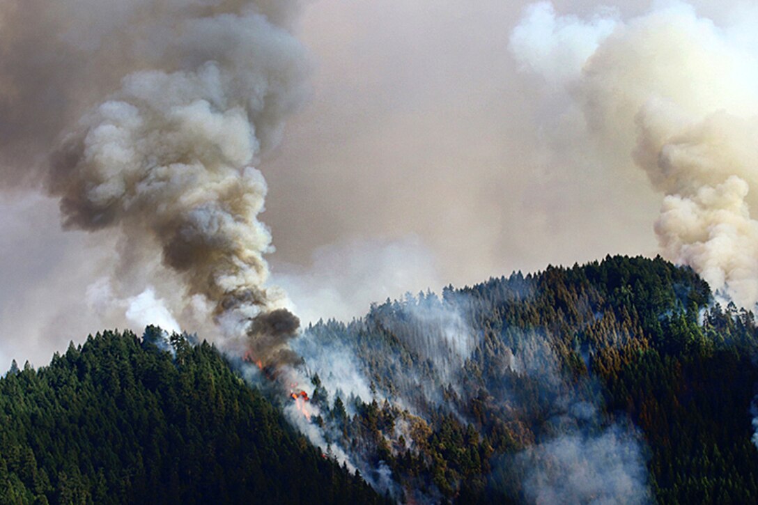 Smoke from the Stouts fire, which covers more than 19,000 acres, plumes
