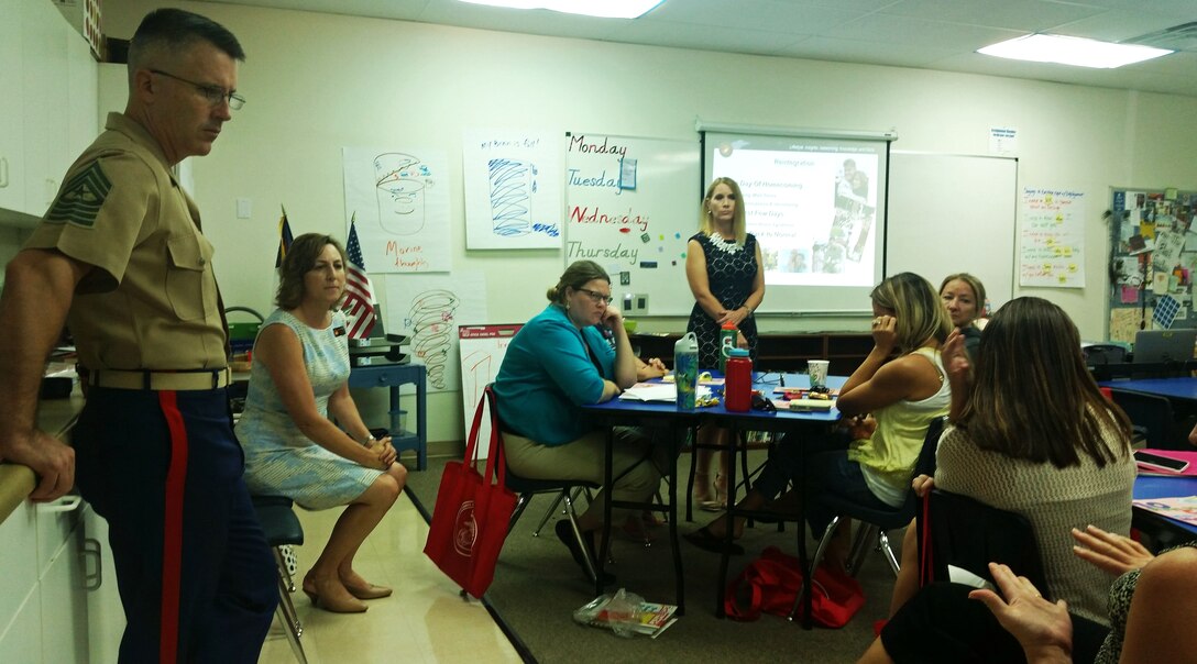 Sgt. Maj. James Willeford, the sergeant major of Marine Fighter Attack Squadron 121, Elena McShane, the Marine Corps Air Station Yuma school liaison, and Angela Olberding, a “LINKS (Lifestyles, Insights, Network, Knowledge & Skills) for Teachers” trainer, field questions from school teachers and staff at Yuma Lutheran School in Yuma, Ariz., Friday, August 7, 2015.