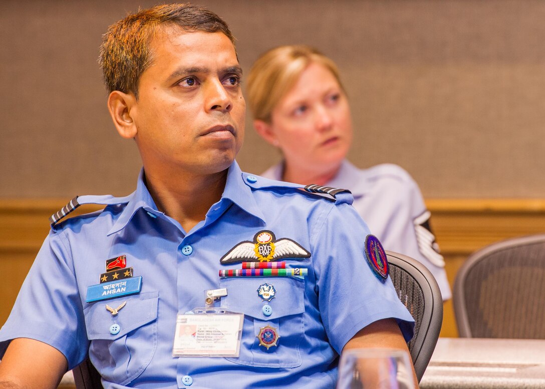 Bangladesh Air Force Wing Commander Ahsanur Rahman, BAF 3rd Squadron, watches a command brief during Airman-to-Airman Talks, Joint Base Pearl Harbor-Hickam, Hawaii, Aug. 4, 2015. The aim of the inaugural U.S. and Bangladesh Airman-to-Airman Talks was to bolster an earnest relationship between key leaders and pave the way for future cooperation among the two air forces. Discussion topics focused on a number of key matters which will enable both countries to plan future bilateral and multilateral engagements in the future. (U.S. Air Force photo by Tech. Sgt. James Stewart/Released)