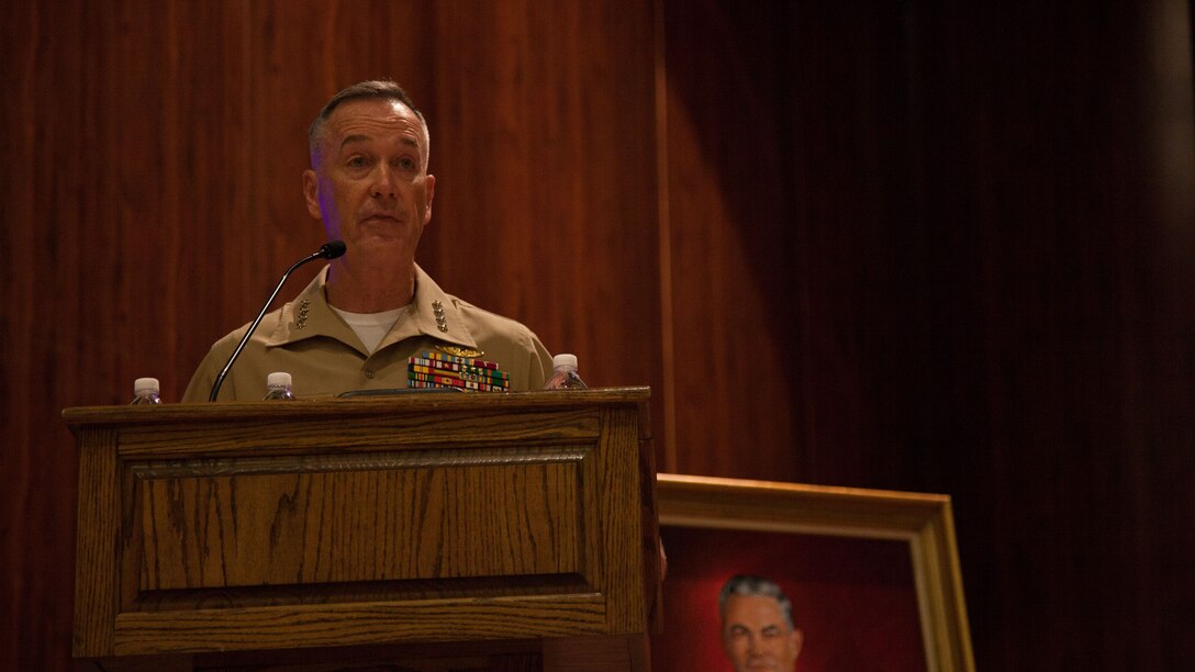 Gen. Joseph F. Dunford, 36th Commandant of the Marine Corps, speaks during a dedication ceremony at the John W. Warner Center for Advanced Military Studies at Marine Corps Base Quantico, Virginia, Aug. 7, 2015. The ceremony honored both Brig. Gen. Edwin H. Simmons and John W. Warner, both of whom played an integral role in improving military education during their careers. 