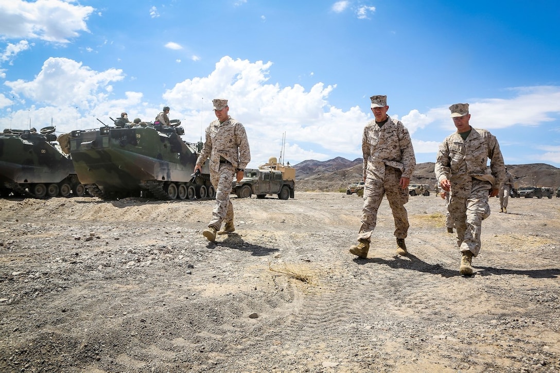 Lieutenant Gen. David H. Berger, center, commanding general of I Marine Expeditionary Force, and Col. William F. McCollough, right, commanding officer of 1st Marine Regiment, visit a training site during an Integrated Training Exercise aboard Marine Corps Air Ground Combat Center Twentynine Palms, Calif., Aug. 6, 2015.  ITX is conducted to enhance the integration and warfighting capability from all elements of the Marine Air Ground Task Force. Berger visited units currently training to support Special Purpose Marine Air Ground Task Force Crisis Response Central Command 16.1. (U.S. Marine Corps Photo by Sgt. Rick Hurtado / Released).