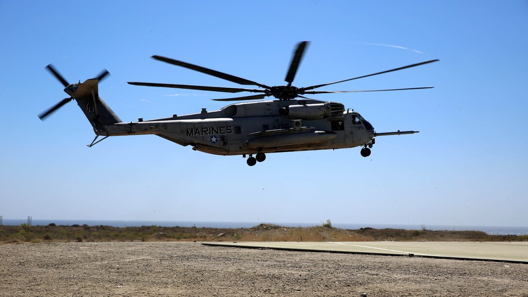 A CH-53E Super Stallion assigned to Marine Heavy Helicopter Squadron 361, 3rd Marine Aircraft Wing, prepares to land before transporting Marines with 3rd Battalion, 5th Marine Regiment, 1st Marine Division, as part of the Marine Corps Combat Readiness Evaluation (MCCRE), aboard Marine Corps Base Camp Pendleton, California, Aug. 4, 2015. The MCCRE is used evaluate the operational readiness of a designated unit. 