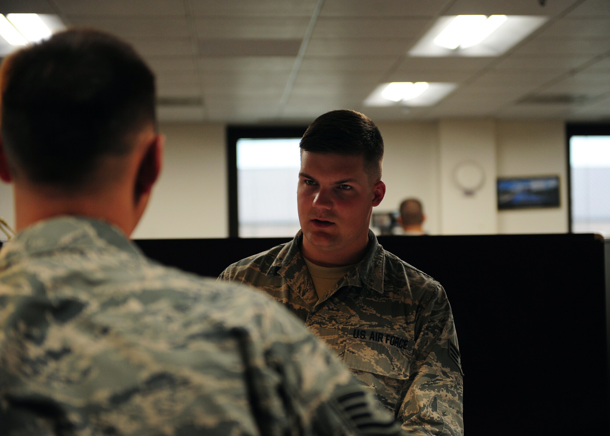 Senior Airman Mason Meherg, 509th Comptroller Squadron financial services technician, in-processes a customer June 18, 2015, at Whiteman Air Force Base, Mo. Meherg was recently named one of 12 Outstanding Airmen of the Year for 2015.
(U.S. Air Force photo by Senior Airman Joel Pfiester/Released)
