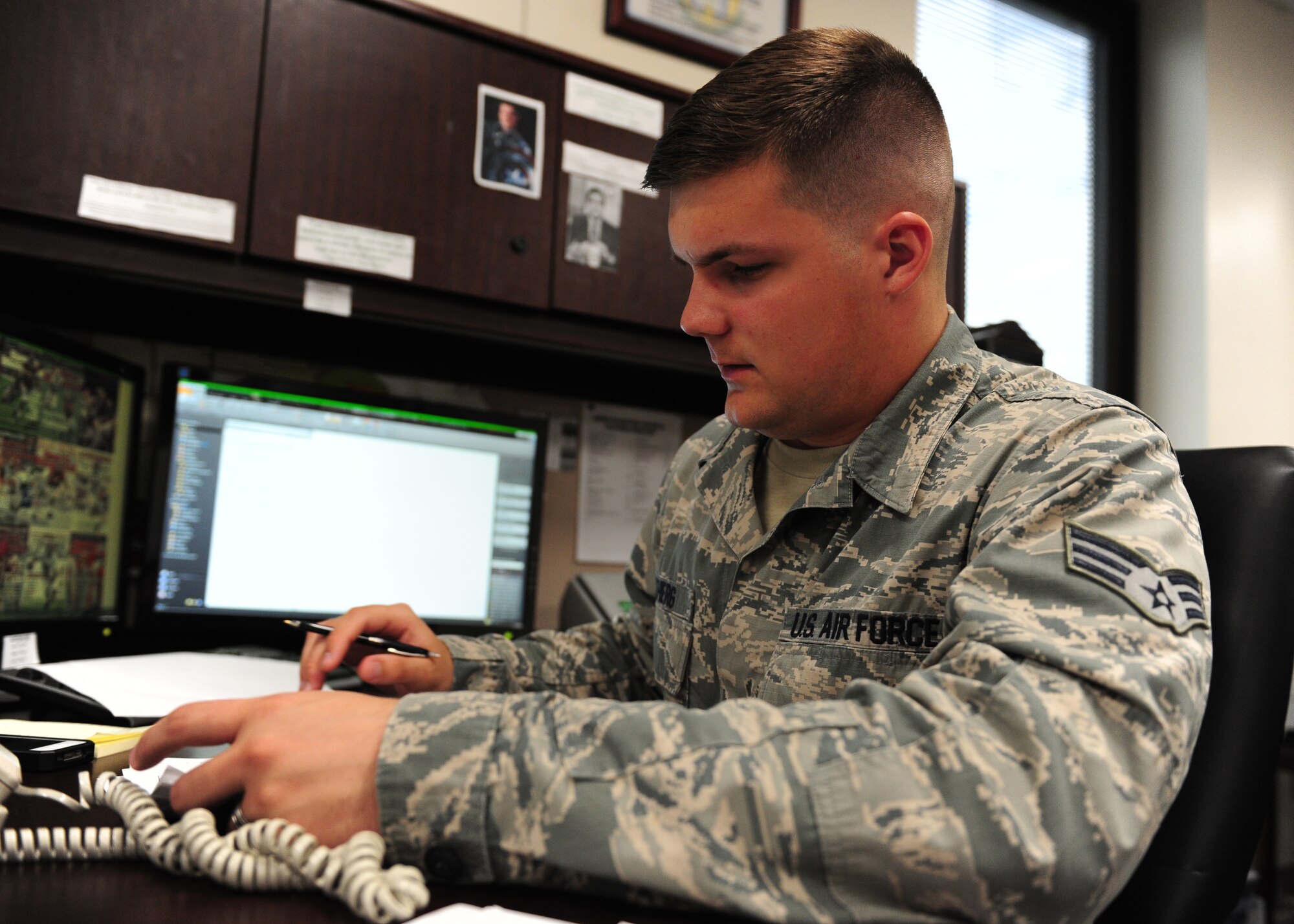 Senior Airman Mason Meherg, 509th Comptroller Squadron financial services technician, audits a military pay cycle, June 18, 2015, at Whiteman Air Force Base, Mo. Meherg was recently named one of 12 Outstanding Airmen of the Year for 2015. (U.S. Air Force photo by Senior Airman Joel Pfiester/Released)