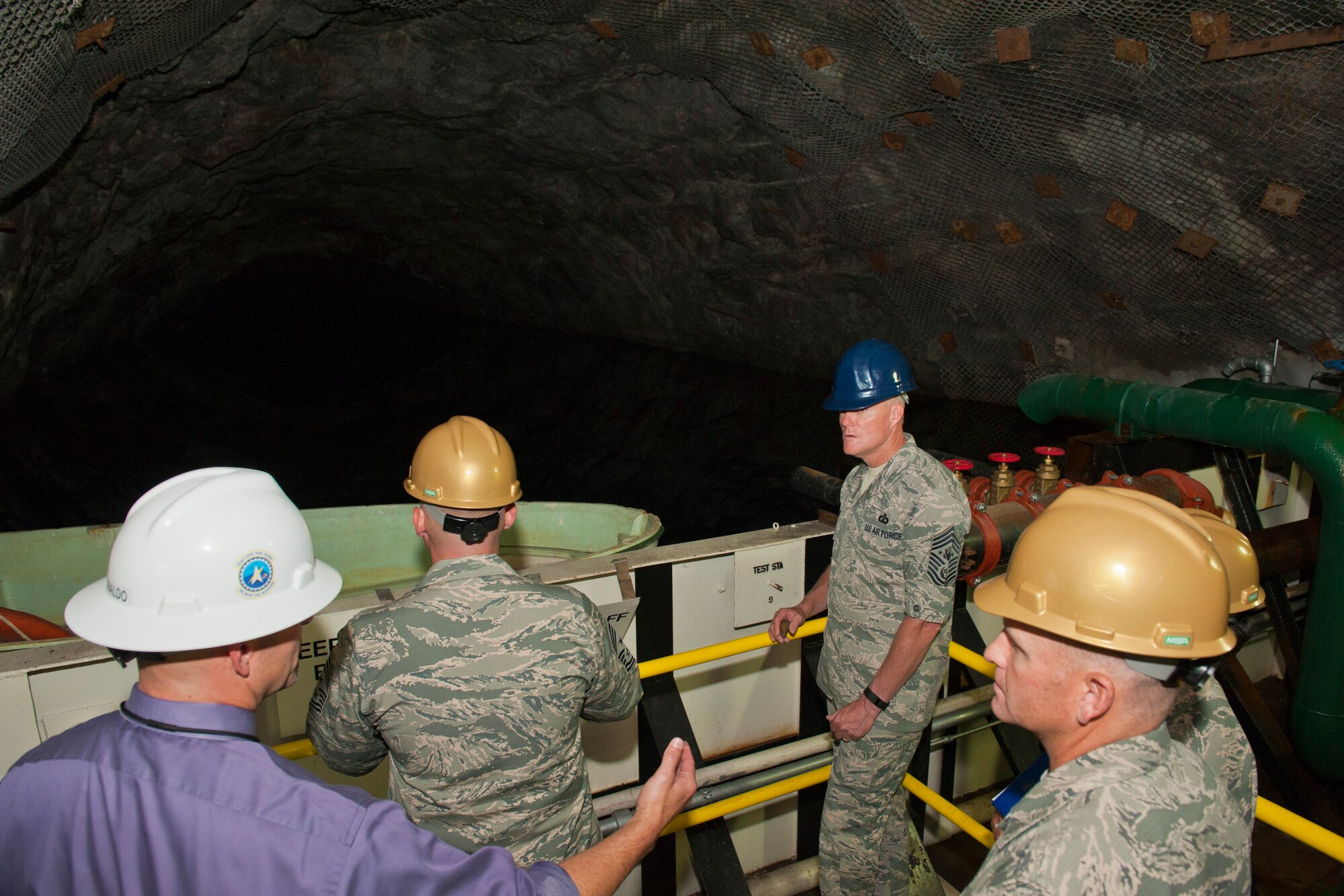 CHEYENNE MOUNTAIN AIR FORCE STATION, Colo. – Chief Master Sgt. of the Air Force James A. Cody visits one of five underground lakes at Cheyenne Mountain Complex, Aug. 6, 2015. This lake is used for industrial purposes, including firefighting or backup heating and cooling; another is used for drinking water to the complex and still another is filled with diesel fuel that would be used to power generators if the complex had to be sealed off. (U.S. Air Force photo by Airman 1st Class Rose Gudex)
