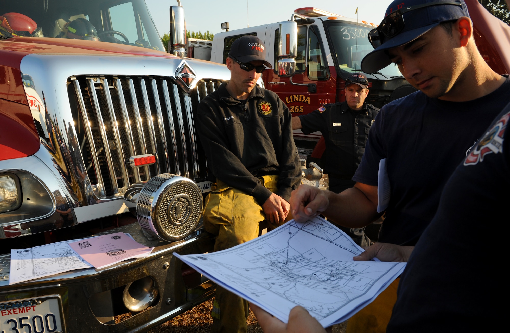 Steven Dobbs, 9th Civil Engineer Squadron fire captain, views a map of terrain near Clearlake, California to help combat a wildfire, Aug. 6, 2015, in Lakeport, California. The Rocky Wildfire has consumed nearly 70,000 acres in Northern California. (U.S. Air Force Photo by Airman Preston L. Cherry)