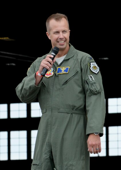 Col. Ty Neuman, 28th Bomb Wing vice commander, addresses 2015 Dakota Thunder Motorcycle Run participants on the flightline at Ellsworth Air Force Base, S.D., Aug. 4, 2015. Neuman highlighted the role the event plays in honoring military members and veterans while also emphasizing the importance of safety during the ride. (U.S. Air Force photo by Senior Airman Anania Tekurio/Released)
