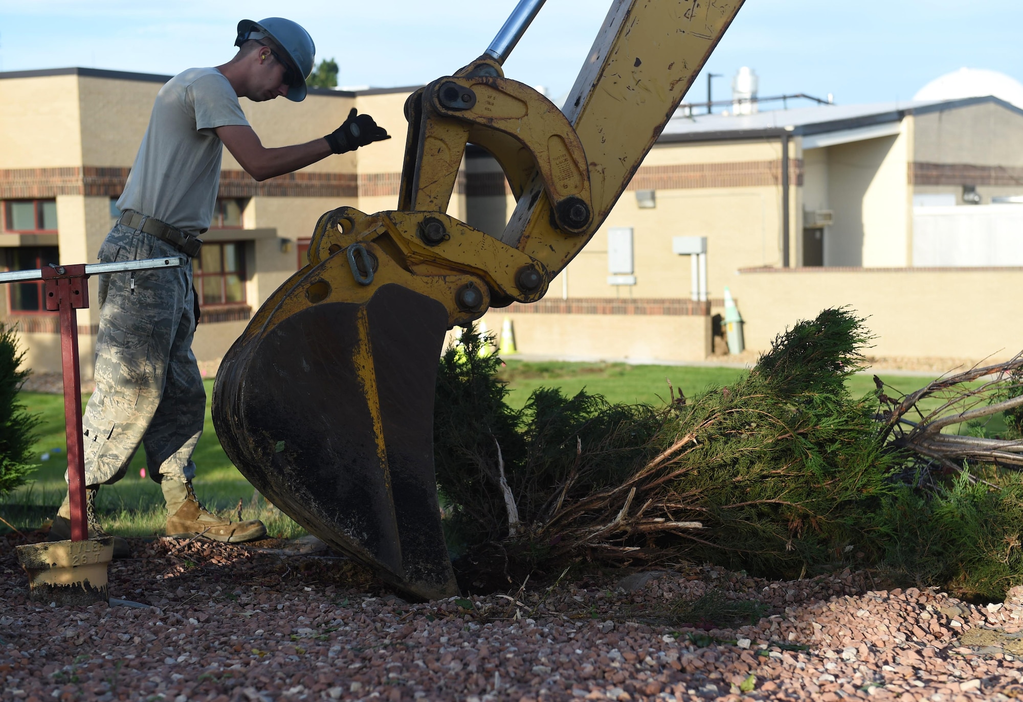 A 460th Civil Engineer Squadron member works on repairing a gas leak outside of Panther Den Aug. 7, 2015, on Buckley Air Force Base, Colo. The gas leak caused a temporary re-route of traffic on Aspen Road between Devils Thumb Avenue and Keystone Avenue and closed Panther Den for part of the day.  (U.S. Air Force photo by Airman 1st Class Samantha Meadors/Released)
