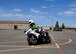 Senior Airman Daniel Keum, 56th Civil Engineer Squadron Explosive Ordnance Disposal technician and Luke motorcycle safety instructor, demonstrates cornering July 28 at the Luke Air Force Base motorcycle riding range. Practicing proper cornering can help with negotiating real-life turns and helps keep the rider safe.