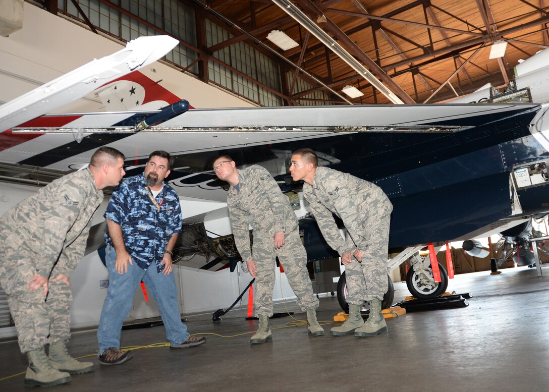 Michael Roth, 362nd Training Squadron F-16 crew chief instructor, explains to his students the several attachment points of the leading edge flap and how it connects to the wing Aug. 7, 2015 at Sheppard Air Force Base, Texas. (U.S. Air Force photo/Senior Airman Robert L. McIlrath)