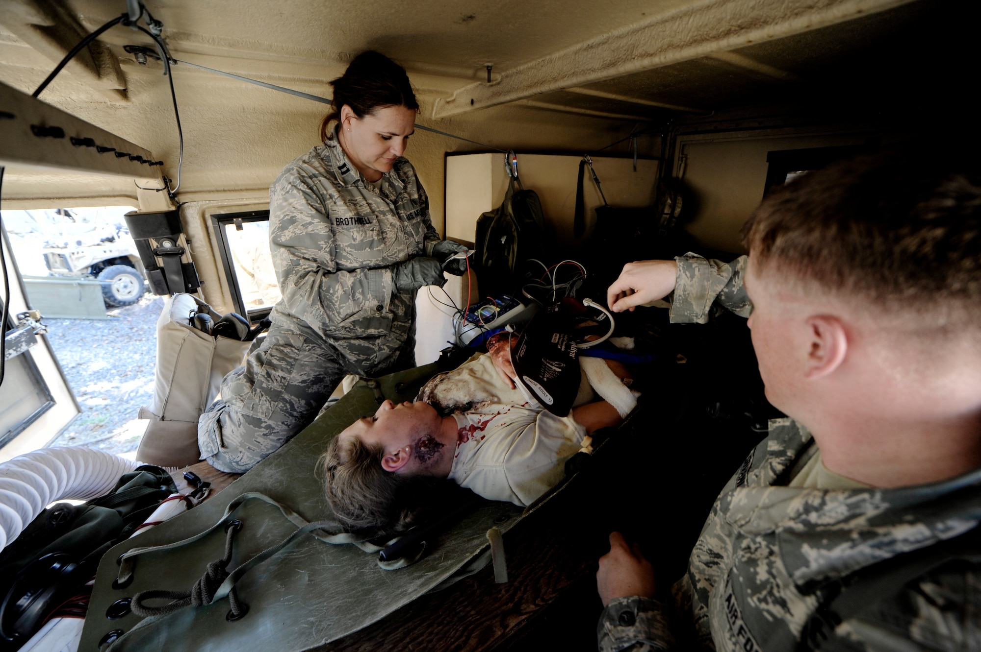 Oregon Air National Guard Senior Airman Melinda Duran, a medic assigned to the 173rd Fighter Wing Medical Group, begins to recieve treatment as she is transported after surviving a simulated collapsed building during Pathfinder-Minutemen Exercise, Aug. 5, 2015 at Camp Rilea in Warrenton, Ore. The annual event is a joint multi-agency, multi-state disaster preparedness exercise based on response to a possible Cascadia Subduction Zone event. Officials believe the Northwest is overdue for a magnitude 7.0 or greater earthquake. (U.S. Air National Guard photo by Tech. Sgt. John Hughel, 142nd Fighter Wing Public Affairs/Released)
