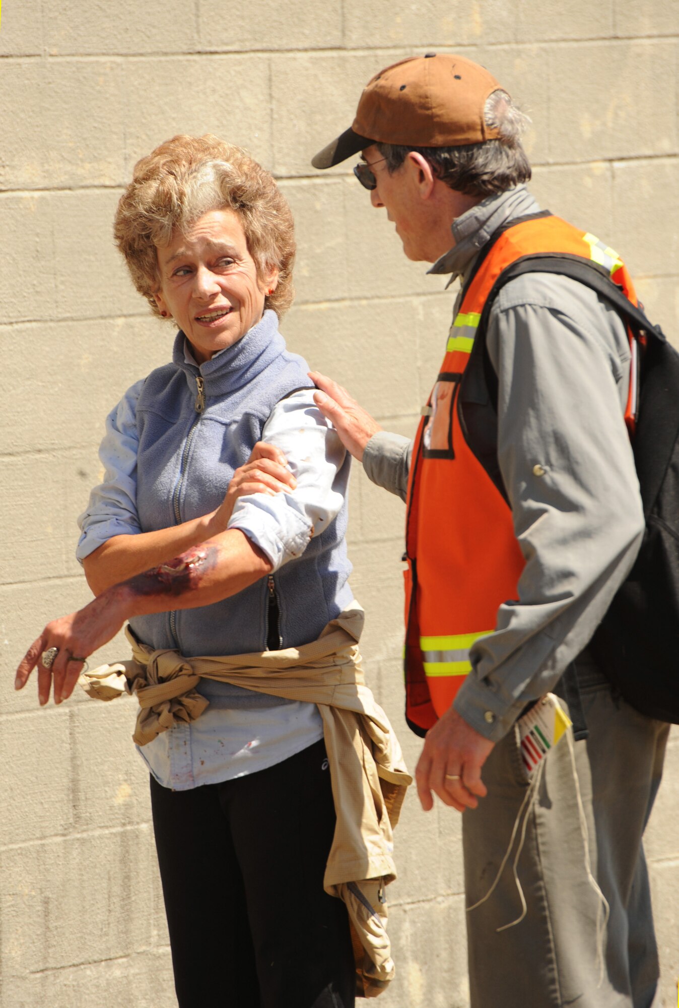 Corinne Bechet, left, a resident of Manzanita, Ore., shows a simulated injury to a medical first responder during the Pathfinder-Minutemen Exercise, Aug. 5, 2015 at Camp Rilea in Warrenton, Ore. The event is a joint multi-agency, multi-state disaster preparedness exercise based on response to a possible Cascadia Subduction Zone event. Officials believe the Northwest is overdue for a magnitude 7.0 or greater earthquake. (U.S. Air National Guard photo by Tech. Sgt. John Hughel, 142nd Fighter Wing Public Affairs/Released)
