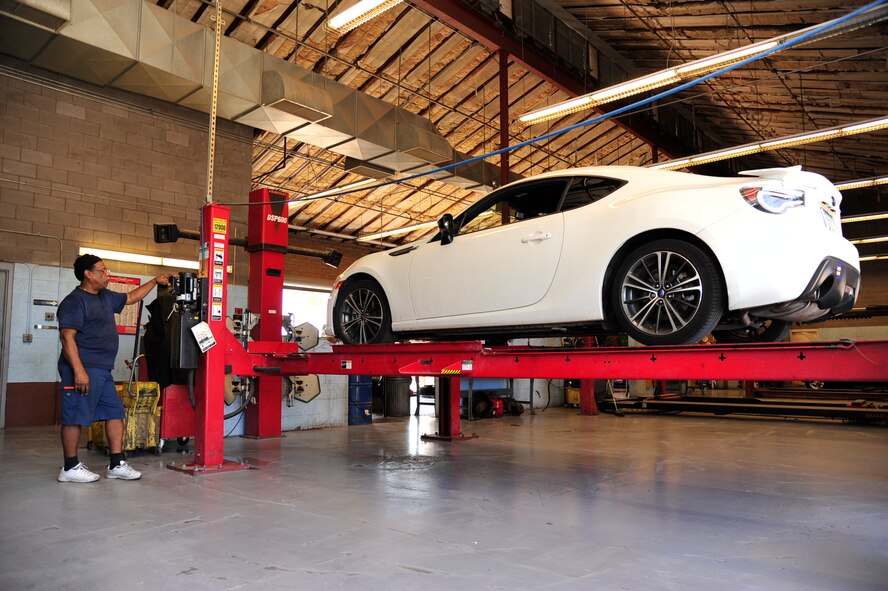 Don Harris, Luke Air Force Base Auto Hobby Shop manager, raises a vehicle using a vehicle lift at the auto hobby shop. The shop offers full-service auto repair, as well as do-it-yourself assistance.