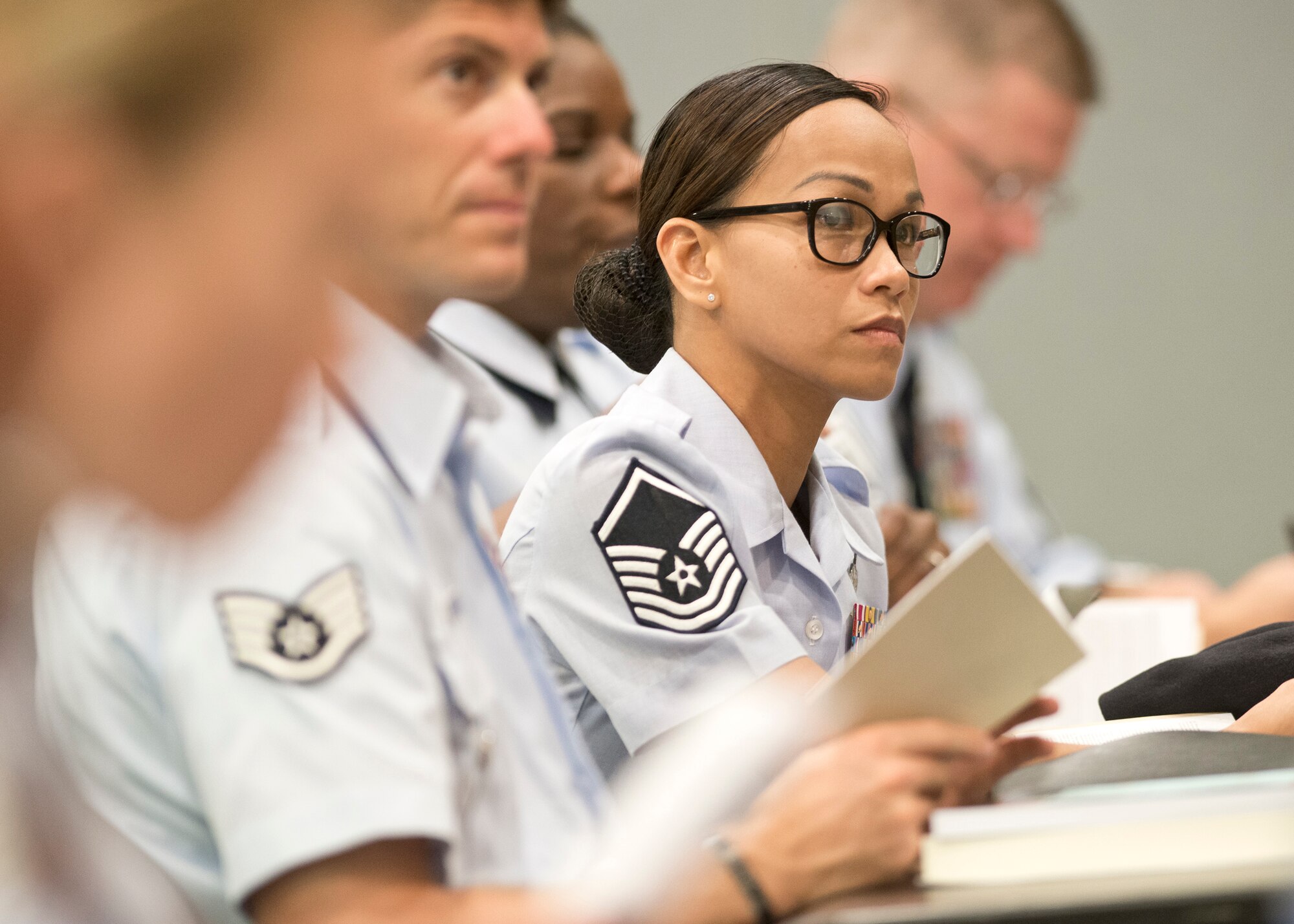 Master Sergeant Maria Victoria R. Quitugua, 2015 Air National Guard Outstanding Senior NCO of the Year, listens to a presentation by Chief Master Sgt. James W. Hotaling, command chief master sergeant of the Air National Guard, during the Chiefs Executive Course at the Air National Guard Readiness Center at Joint Base Andrews, Md., Aug. 3, 2015. Quitugua is a security forces Airman from the Guam Air National Guard's 254th Security Forces Squadron. (Air National Guard photo by Master Sgt. Marvin. R. Preston, Released)