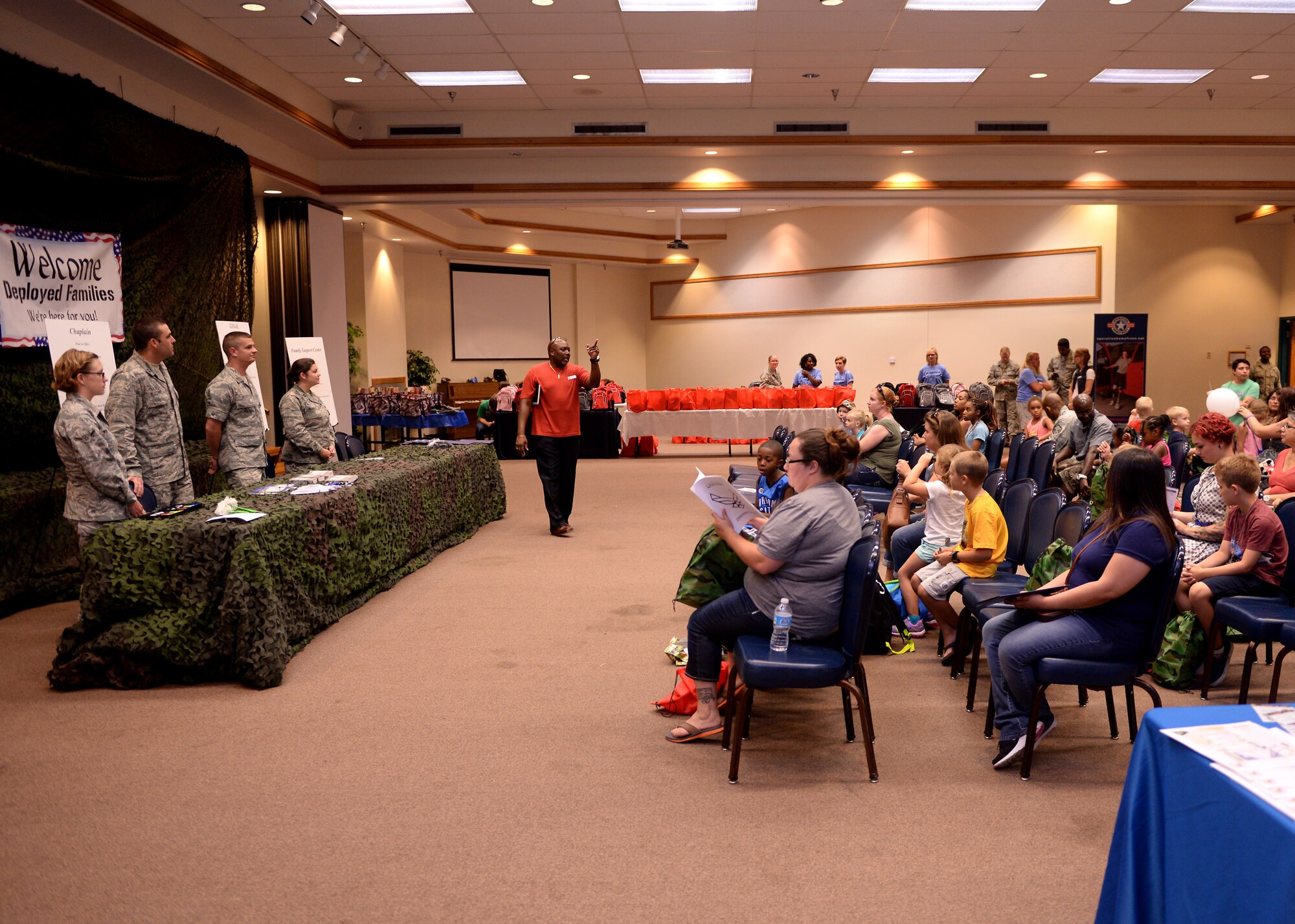 ALTUS AIR FORCE BASE, Okla. – Nathan Covington, 97th Force Support Squadron school liaison officer, speaks to dependents participating in Operation Deploying Family at the Freedom Community Center, Aug. 5, 2015. Operation Deploying Family was open to all military dependents and was intended to provide military family members insight into what their loved ones experience when preparing for a deployment. (U.S. Air Force photo by Airman 1st Class Megan E. Acs/Released) 