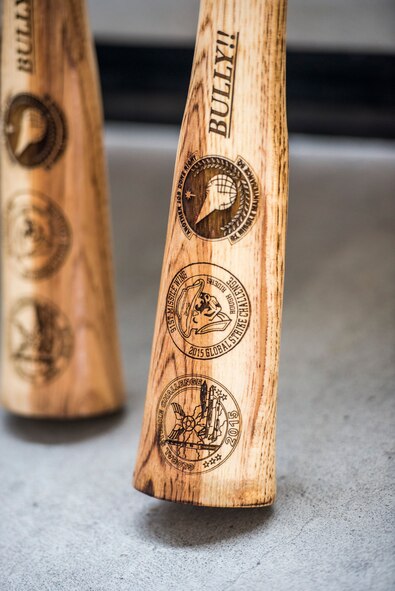 A 91st Missile Maintenance Squadron bully stick sits propped against a garage door inside the 91st MW Bully Dome at Minot Air Force Base, N.D., Aug. 6, 2015. Personalized bully sticks were made for each 91st MW Global Strike Challenge competitor and presented to them during the official kickoff. (U.S. Air Force photo/Airman 1st Class Justin T. Armstrong)