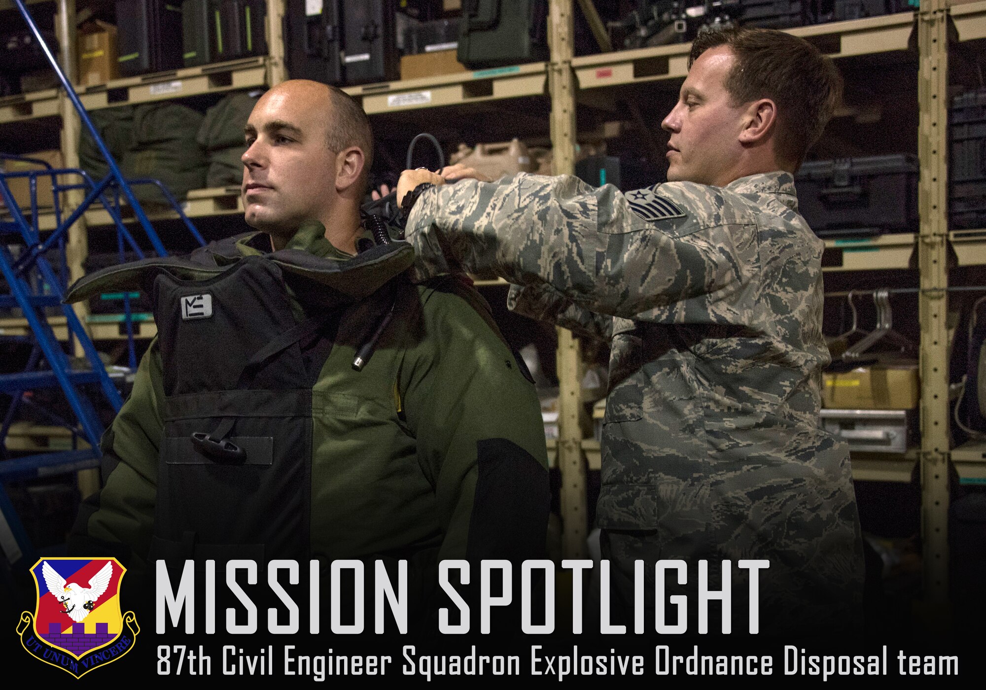 Tech. Sgt. Travis Groeschel, 87th Civil Engineer Squadron Explosive Ordnance Disposal NCO in charge, helps secure a bomb suit onto Senior Airman David Leventhal, 87th EOD journeyman, during a training exercise at Joint Base McGuire-Dix-Lakehurst, N.J., Aug. 3, 2015. The bomb suit is several layers thick and is designed to ensure maximum coverage in the event a bomb is detonated. (U.S. Air Force photo by Senior Airman Tara A. Williamson/Released)