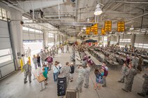 Airmen from the 91st Missile Wing grab lunch during the official Global Strike Challenge kickoff in the 91st MW Bully Dome at Minot Air Force Base, N.D., Aug. 6, 2015. Hamburgers and hotdogs were grilled for attendees at the kickoff. (U.S. Air Force photo/Airman 1st Class Justin T. Armstrong)