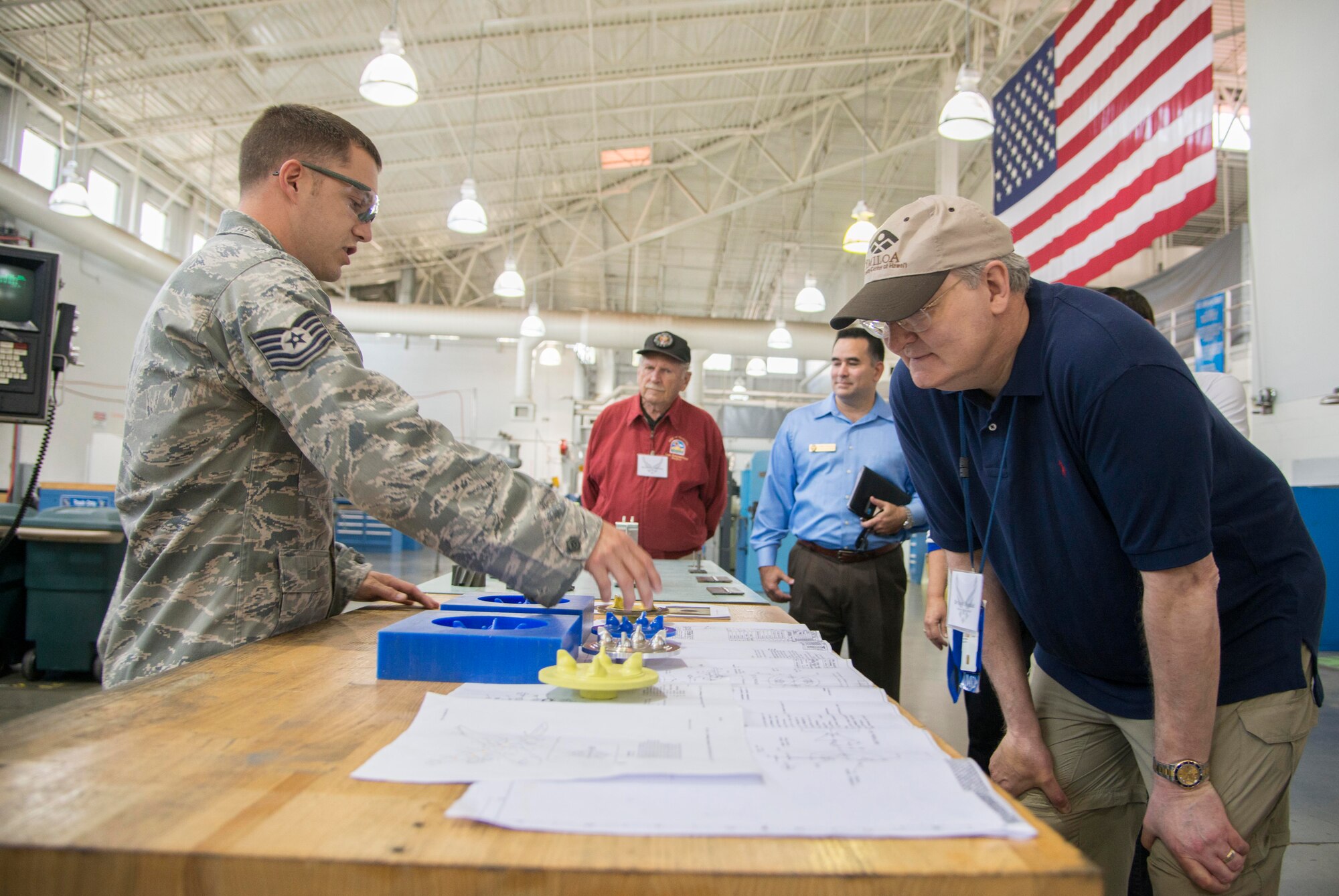 Tech. Sgt. Christopher Lauer, 60th Maintenance Squadron metals technology flight, briefs civic leaders and honorary commanders about the metals flight mission and having to recreate new parts for aircraft during a tour of the 60th Maintenance Group July 31, 2015. This was the second of the quarterly tours to visit each of the groups in the 60th Air Mobility Wing and showcase their unique mission to the civic leaders and honorary commanders. (U.S. Air Force photo/Senior Airman Nicole Leidholm)