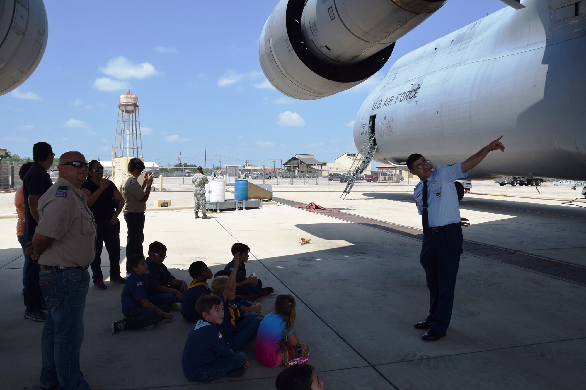 Staff Sgt. Raymond Gonzalez, an aircraft maintenance instructor from the Inter-American Air Force Academy at Joint Base San Antonio-Lackland, Texas points out the tail of the C-5A Galaxy on Aug. 6, 2015 to the Scouts from Troop 375. The Scouts also went aboard the C-5A to see the cargo area and flight deck.  (U.S. Air Force photo/Tech. Sgt. Carlos J. Trevino)