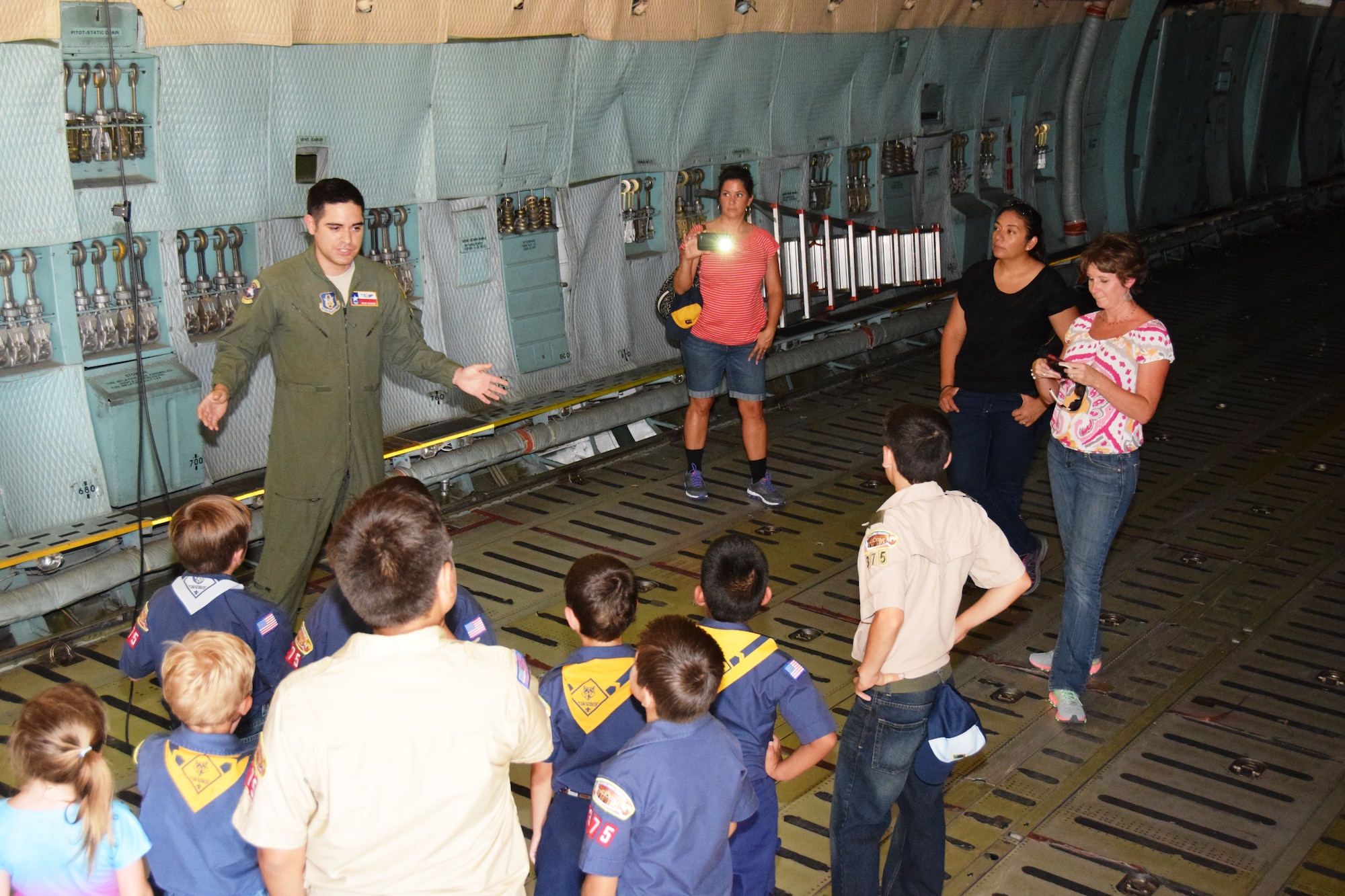 Tech. Sgt. Jesse Sanchez, 68th Airlift Squadron loadmaster, explains the cargo carrying capabilities of the C-5A Galaxy aircraft to Boy Scout Troop 375 at Joint Base San Antonio-Lackland, Texas on Aug. 6, 2015 Sanchez then gave a tour of the cockpit and flight deck to the Scouts. (U.S. Air Force photo/Tech. Sgt. Carlos J. Trevino)